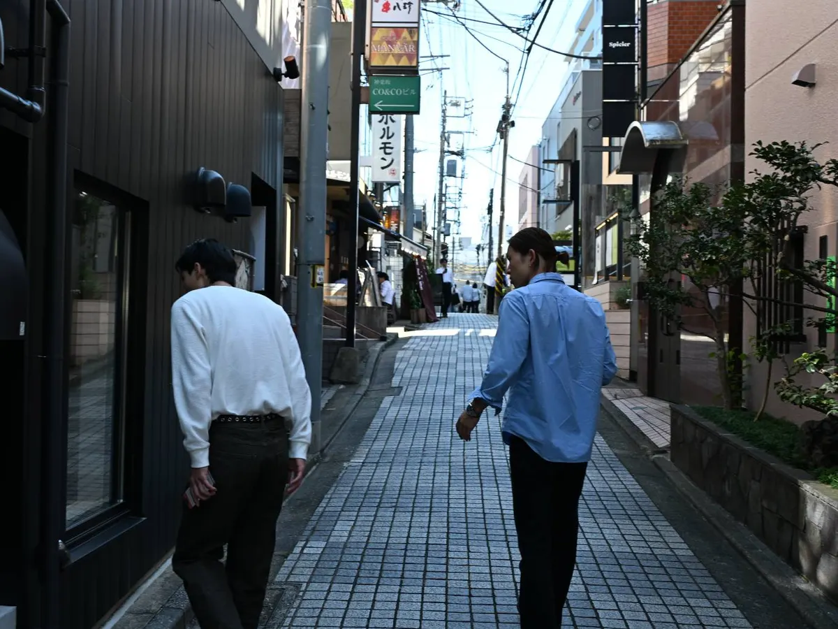 Members walking down an alley in Kagurazaka