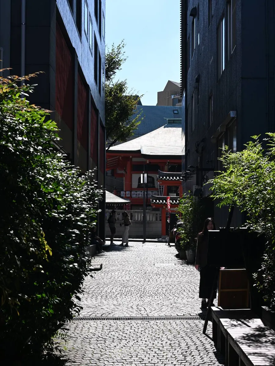 A shrine at the end of a stone-paved alley